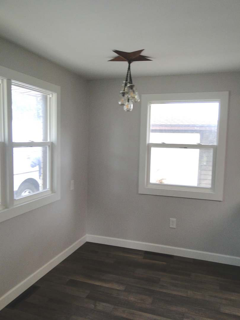 839 County Rd S 419 East Kankakee, IL 60901 - Photo 10 of 20 a view of an empty room with wooden floor and a window