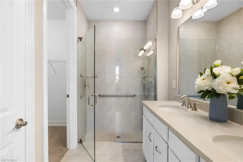 a bathroom with a sink vanity and a mirror