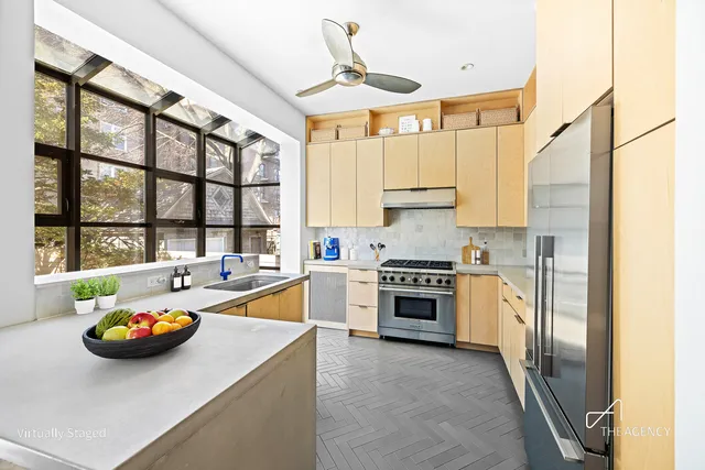 a kitchen with a sink appliances and cabinets