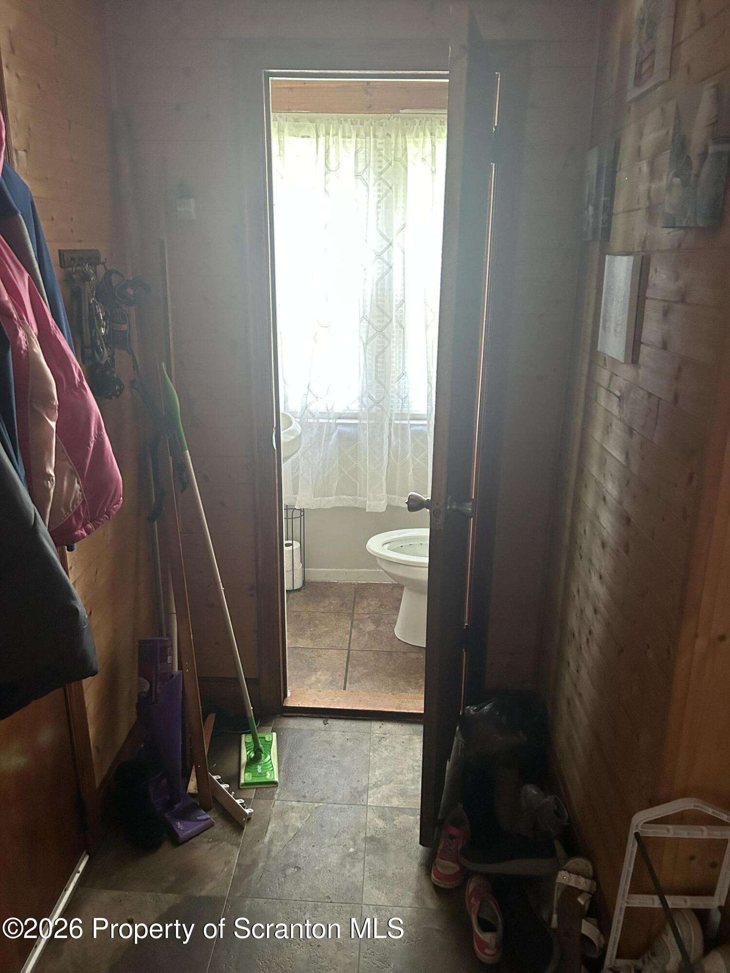 63 Shannon Street Simpson, PA 18407 - Photo 12 of 18 a bathroom with a sink and a mirror