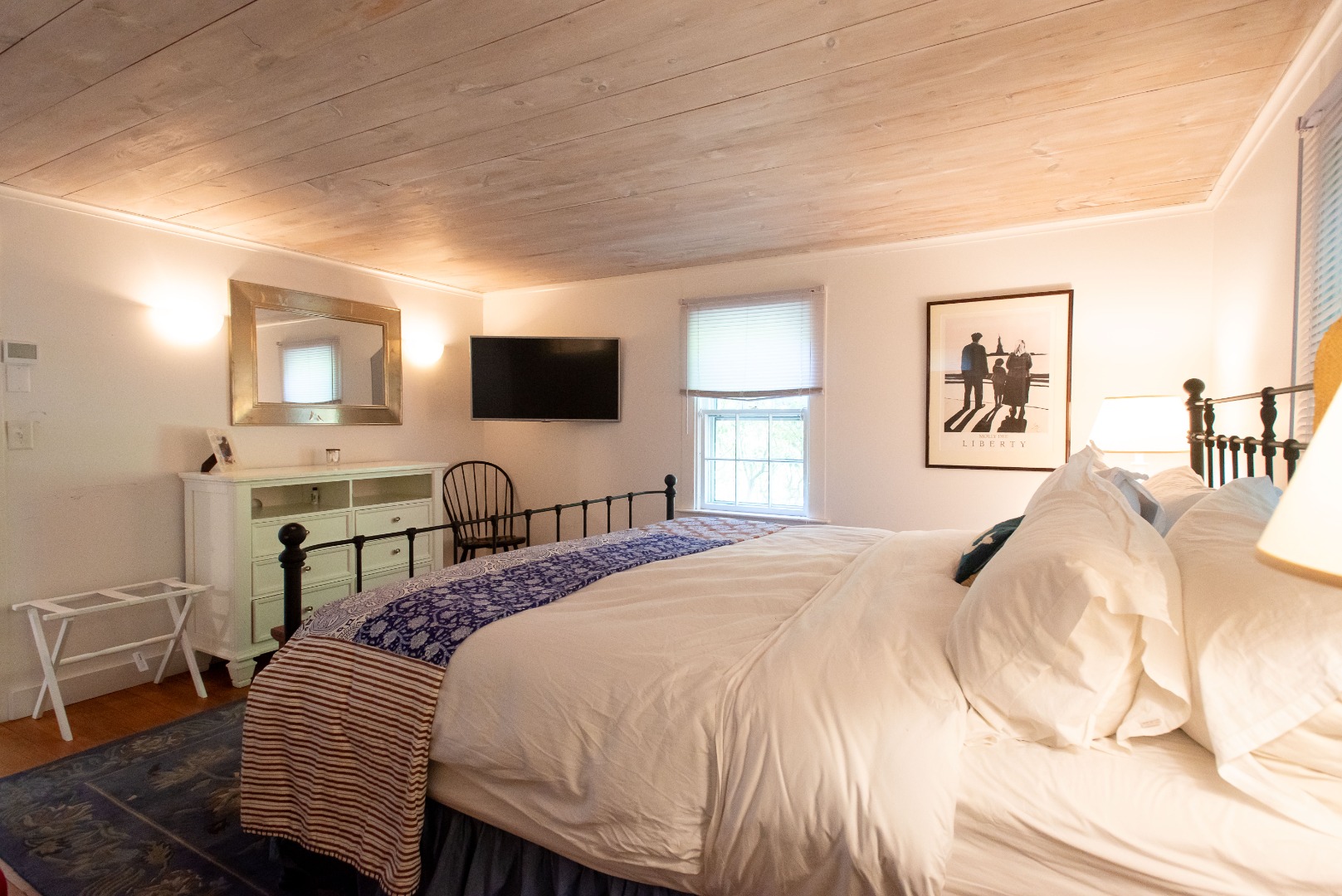 16 H Milestone Road, Unit 8 DIONIS Nantucket, MA 02554 - Photo 16 of 22 a bedroom with a bed and a flat screen tv