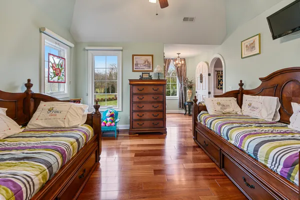 a view of hallway with wooden floor