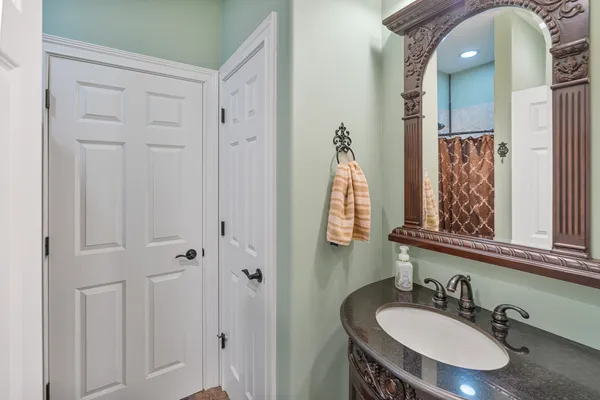 a picture of a bathroom with a picture of a wall