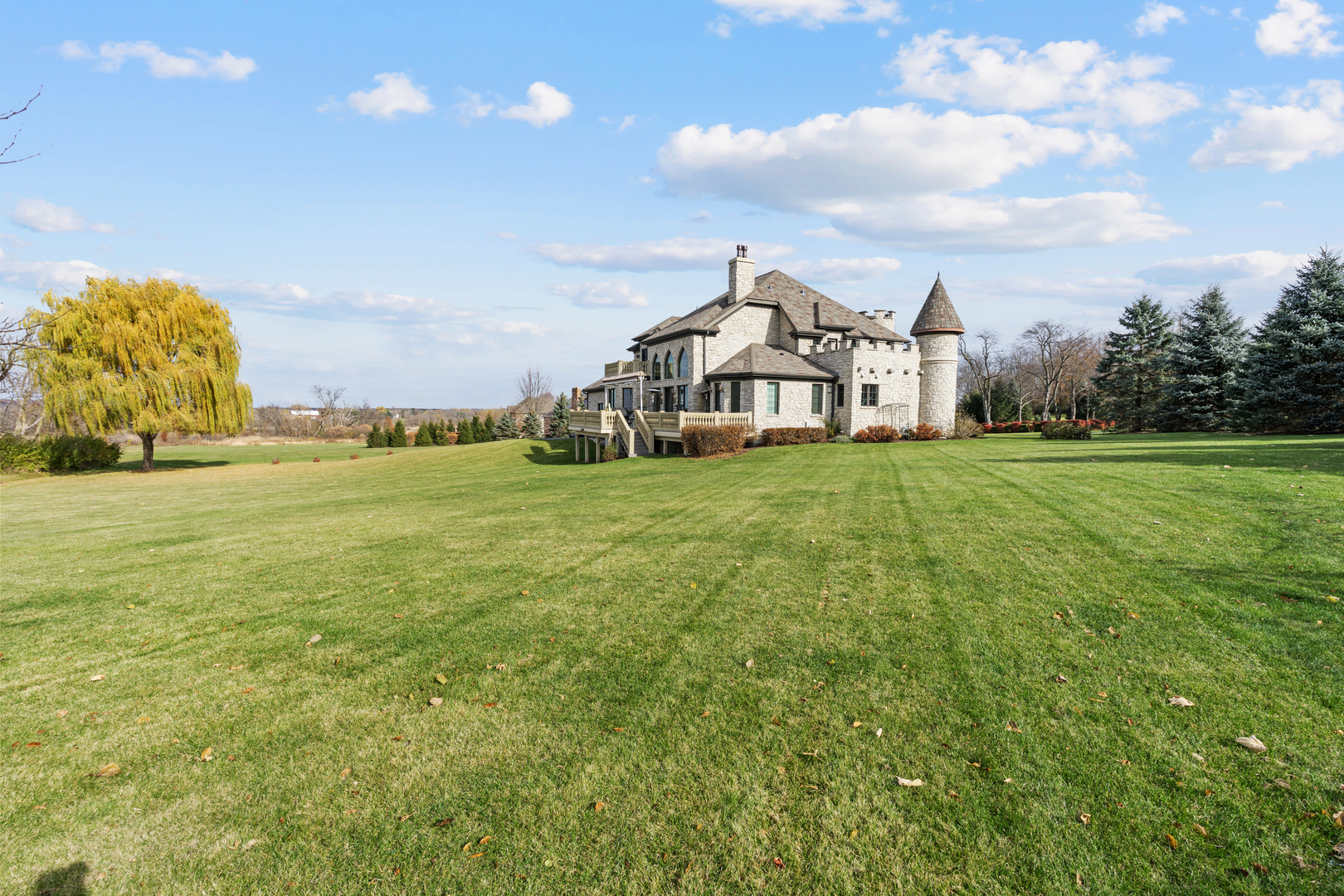 4220 Northgate Drive Spring Grove, IL 60081 - Photo 77 of 105 a view of a large house with a big yard and large trees