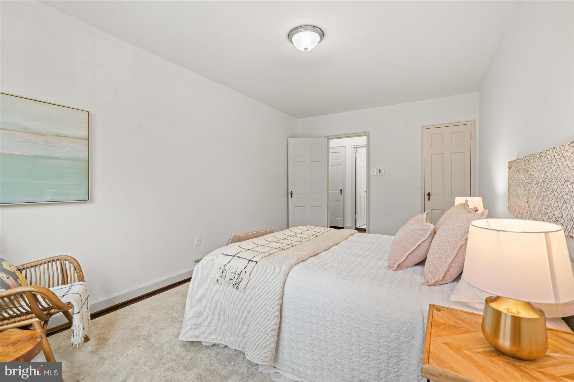 12 Ashby Street, Unit F Alexandria, VA 22305 - Photo 14 of 20 a bedroom with a bed and chair