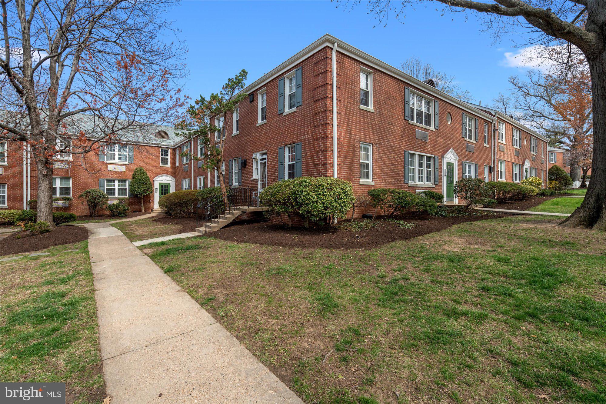 12 Ashby Street, Unit F Alexandria, VA 22305 - Photo 17 of 20 a view of a building with a yard