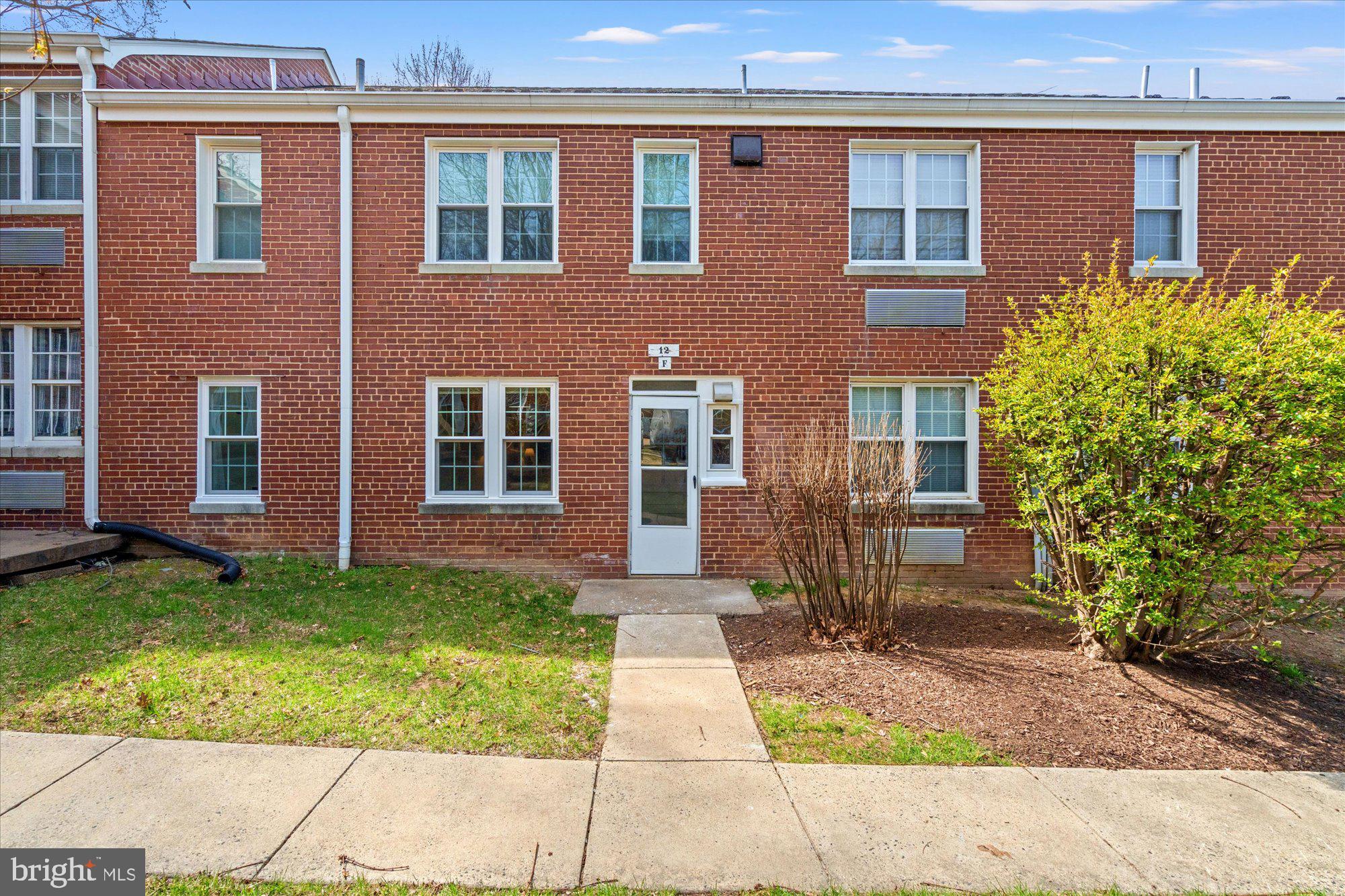 12 Ashby Street, Unit F Alexandria, VA 22305 - Photo 20 of 20 a front view of a house with garden