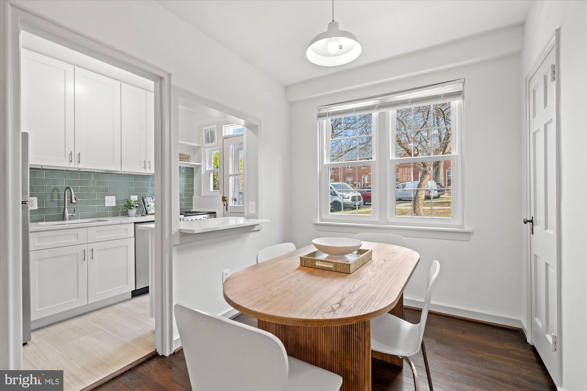 12 Ashby Street, Unit F Alexandria, VA 22305 - Photo 6 of 20 a view of a a dining room with furniture window and wooden floor