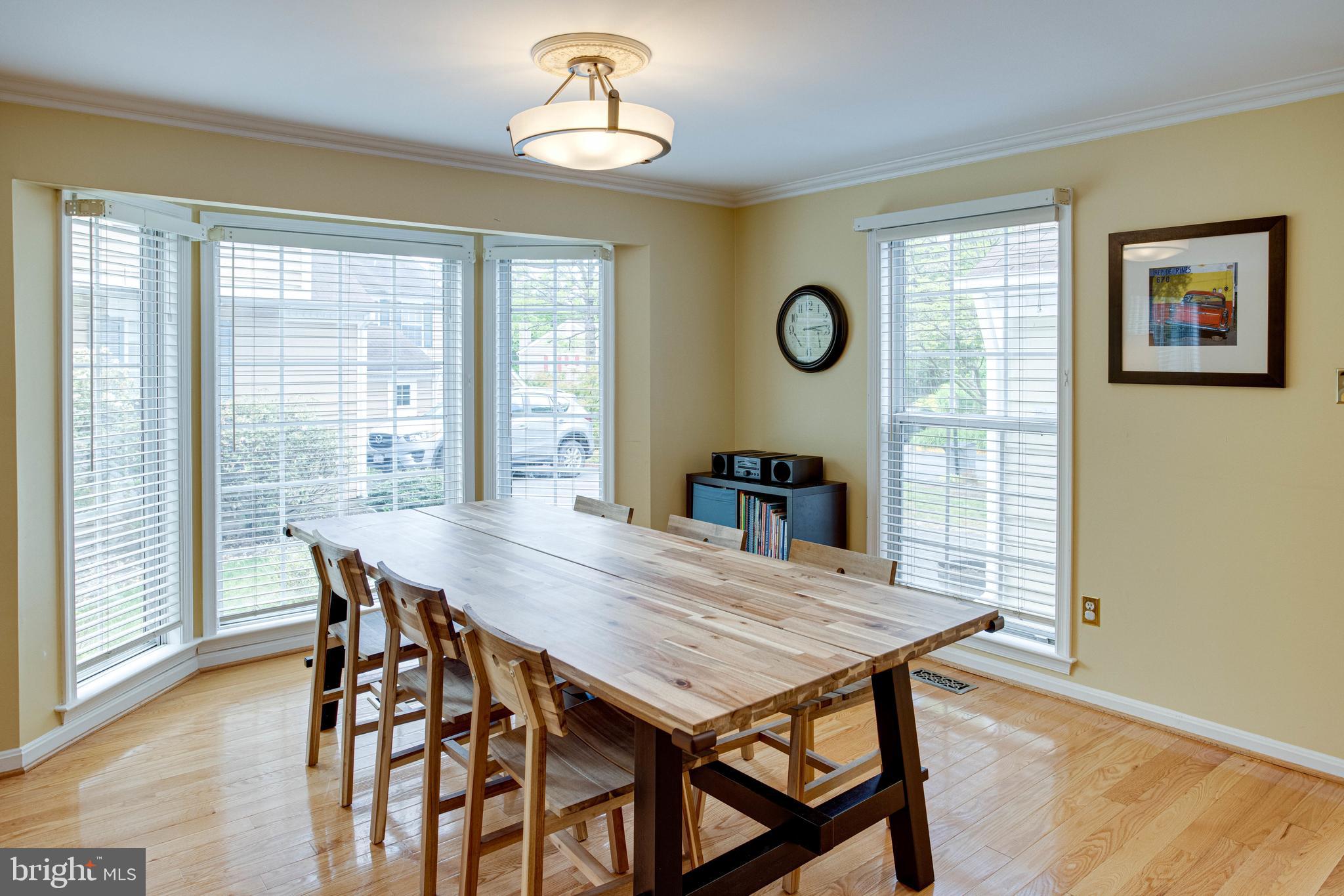 1542 Deer Point Way Reston, VA 20194 - Photo 9 of 68 Dining Area with Bay Window and Crown Molding
