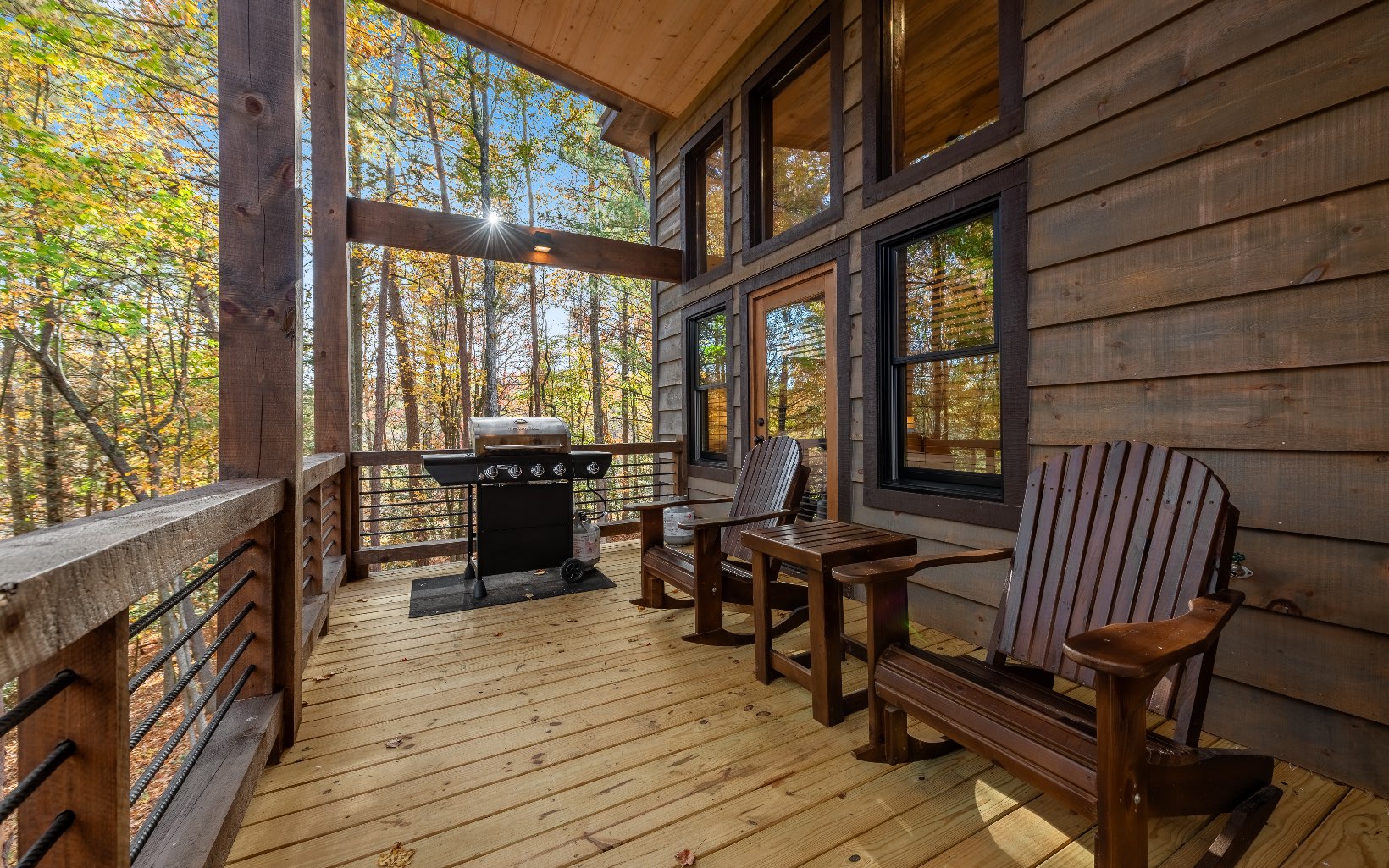 106 Saffron Lane Blue Ridge, GA 30513 - Photo 19 of 58 a view of a balcony with chairs and wooden floor