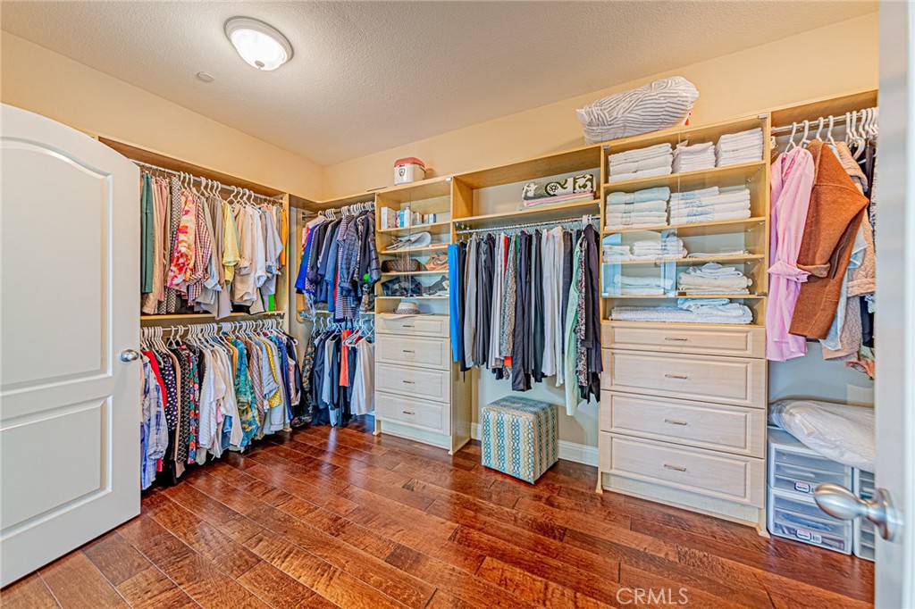 4088 Shady Ridge Circle Corona, CA 92881 - Photo 30 of 47 a view of walk in closet with clothes