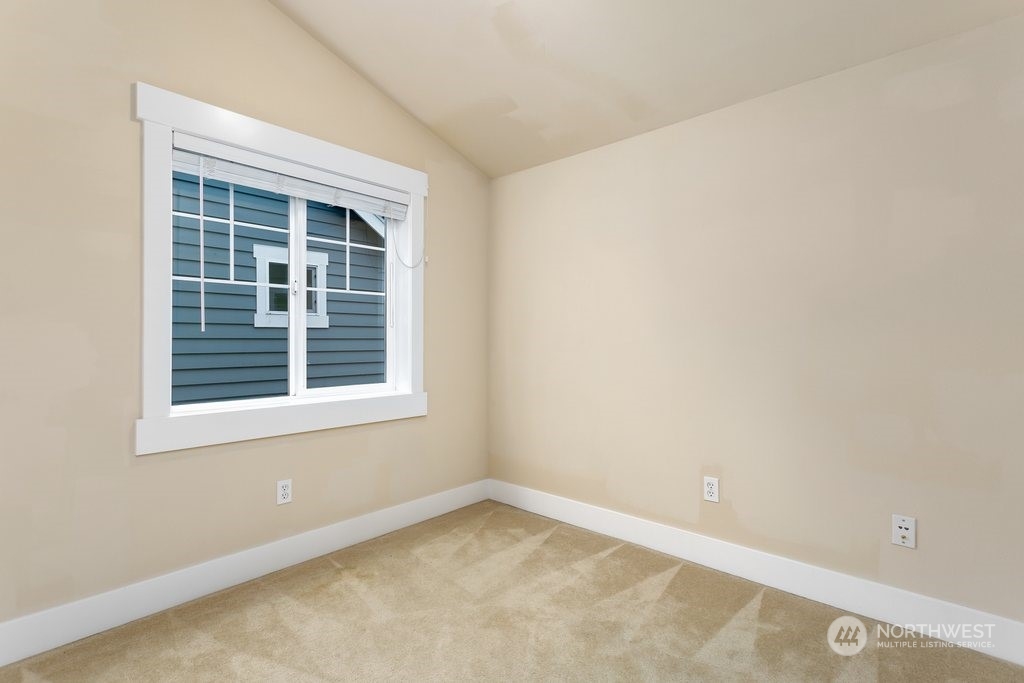 910 Northwest 85th Street, Unit A Seattle, WA 98117 - Photo 17 of 29 an empty room with a window