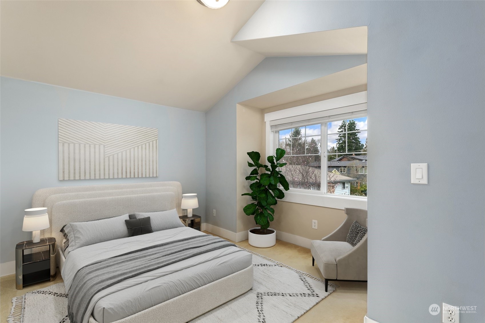 910 Northwest 85th Street, Unit A Seattle, WA 98117 - Photo 22 of 29 a bedroom with a large bed and a potted plant