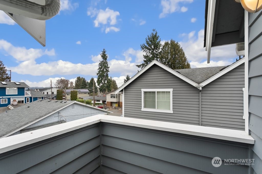 910 Northwest 85th Street, Unit A Seattle, WA 98117 - Photo 25 of 29 a view of a house with a balcony