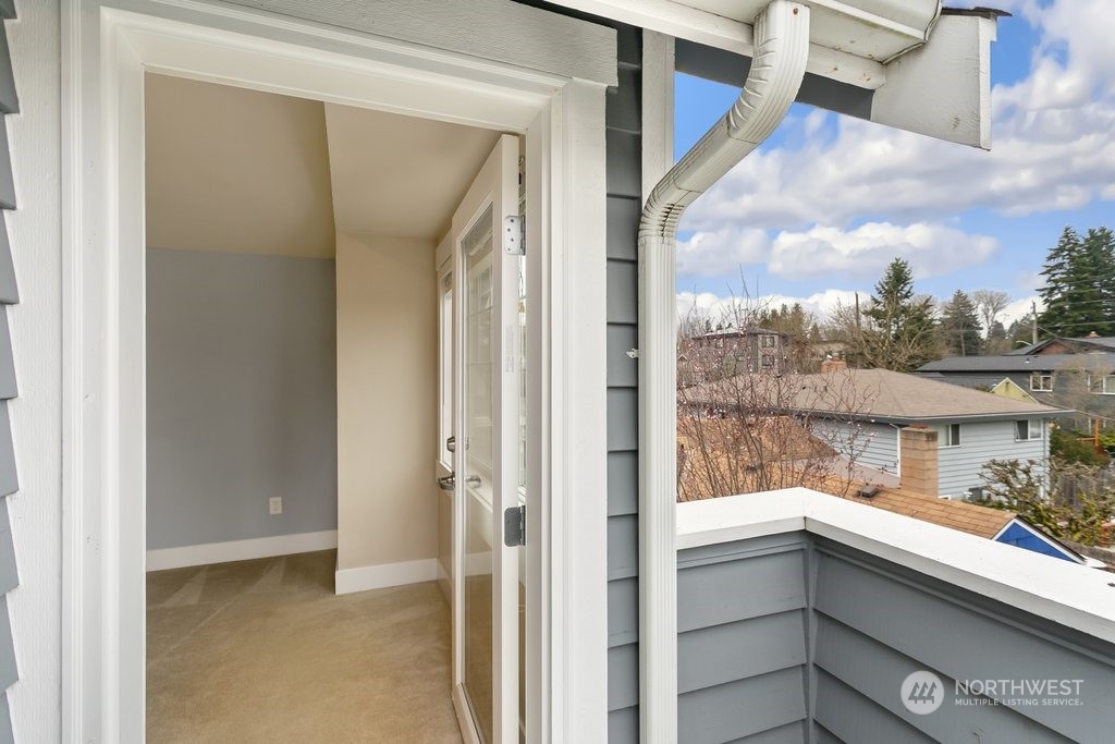 910 Northwest 85th Street, Unit A Seattle, WA 98117 - Photo 26 of 29 a view of walk in closet with a bathroom