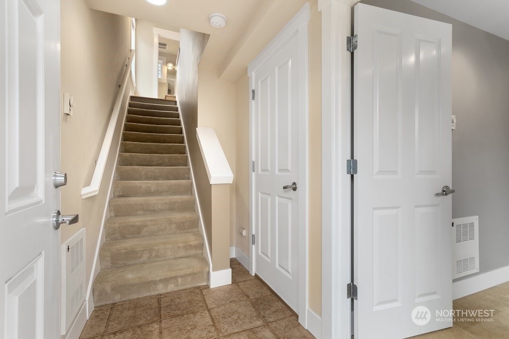 910 Northwest 85th Street, Unit A Seattle, WA 98117 - Photo 4 of 29 a view of a hallway with front door