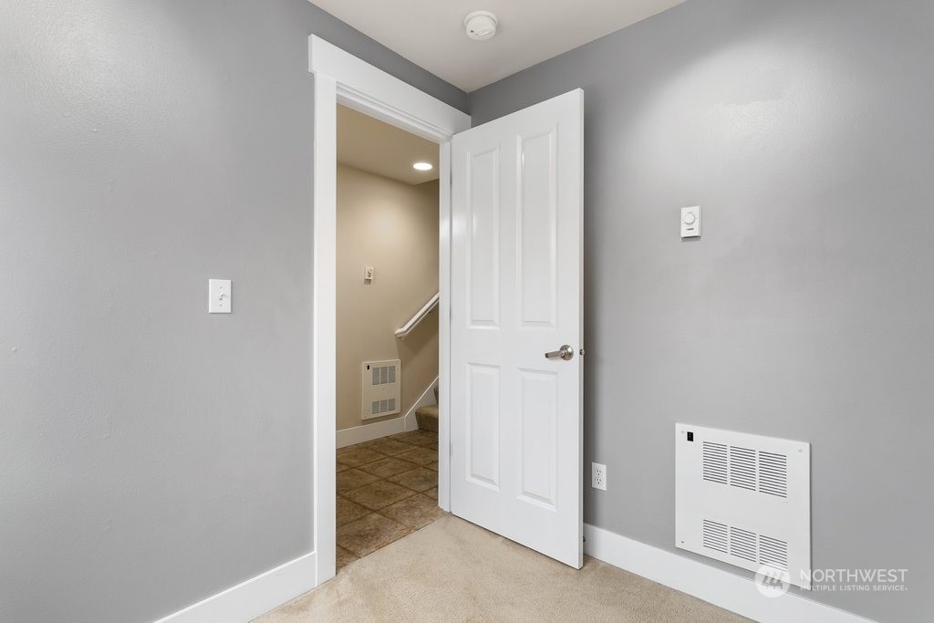 910 Northwest 85th Street, Unit A Seattle, WA 98117 - Photo 6 of 29 a view of a hallway with a room and a bathroom