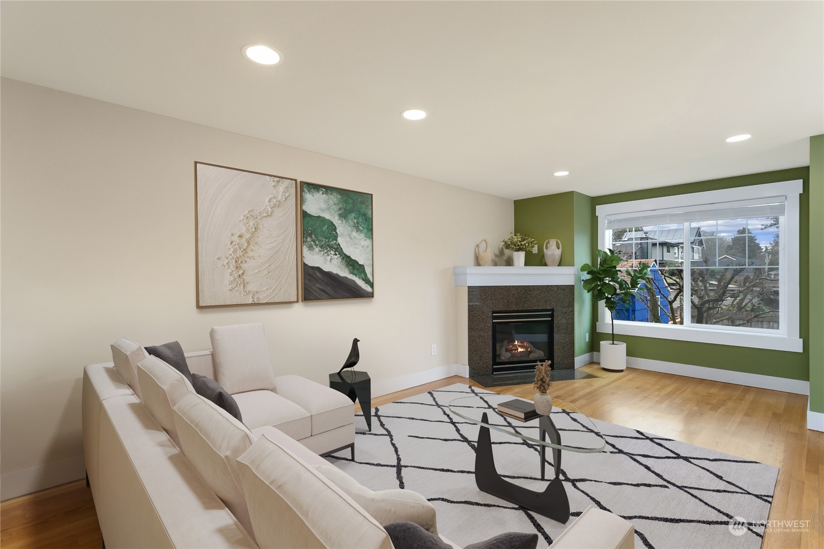 910 Northwest 85th Street, Unit A Seattle, WA 98117 - Photo 10 of 29 a living room with furniture and a fireplace