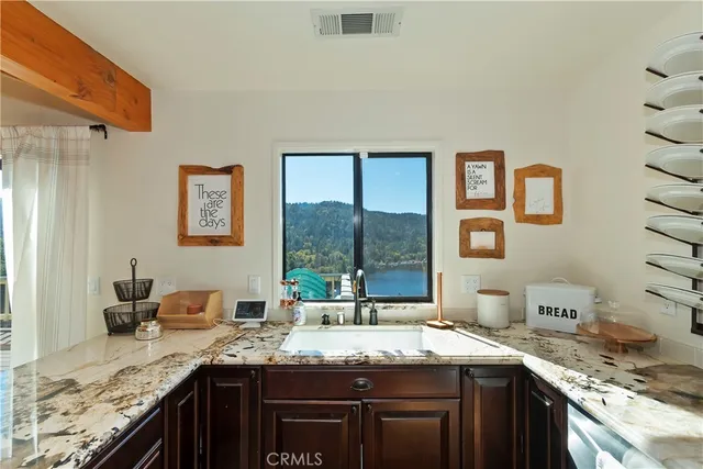 a kitchen with stainless steel appliances granite countertop a stove and a sink