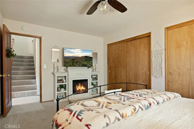 a bathroom with a sink toilet vanity and shower