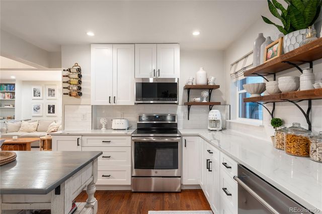 a kitchen with a stove and a sink