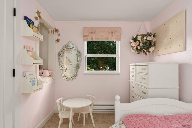 a bedroom with a bed and dresser