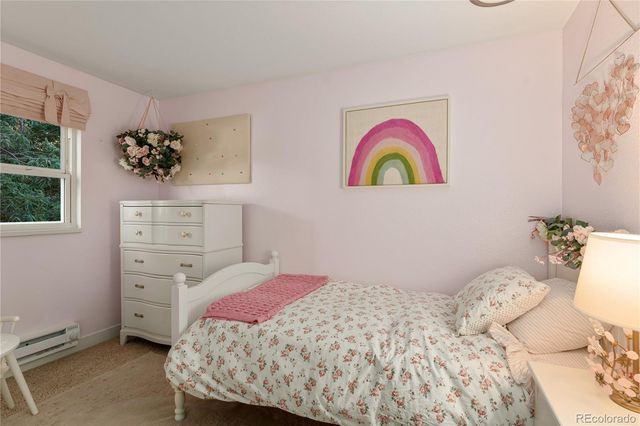 a bathroom with a granite countertop shower a sink and a toilet