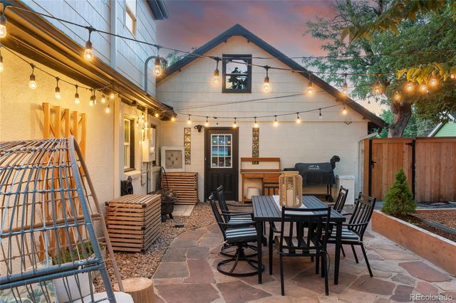 a view of a backyard with wooden fence