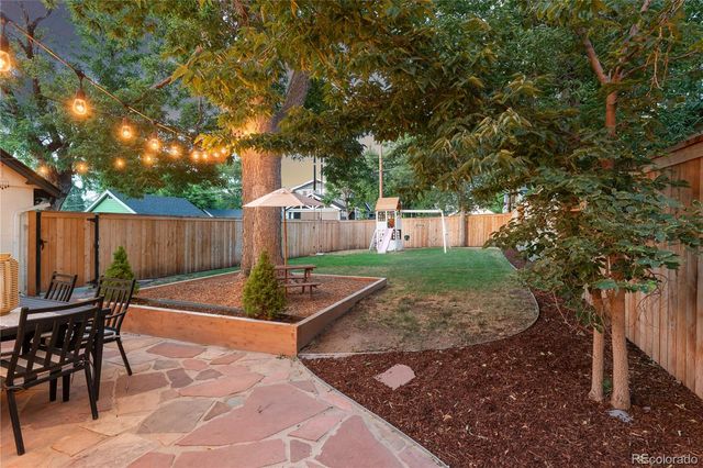 a view of a park with large trees
