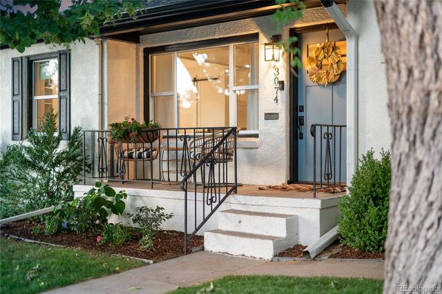 a view of balcony with furniture and garden