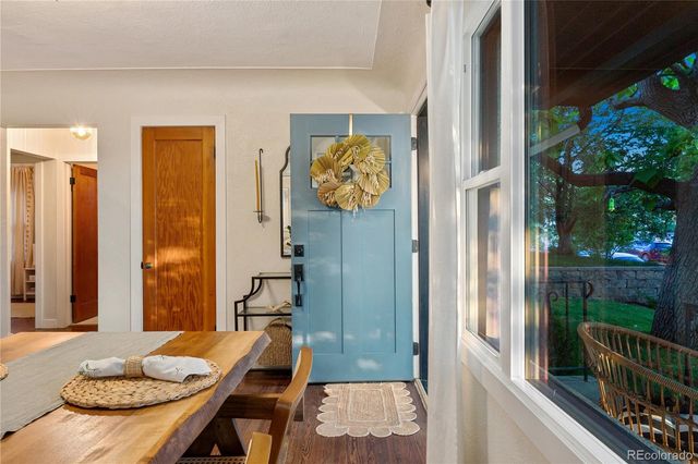 a view of a balcony with table and chairs