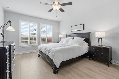 a bedroom with a bed and a flat tv screen