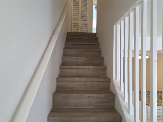 a view of hallway with wooden floor
