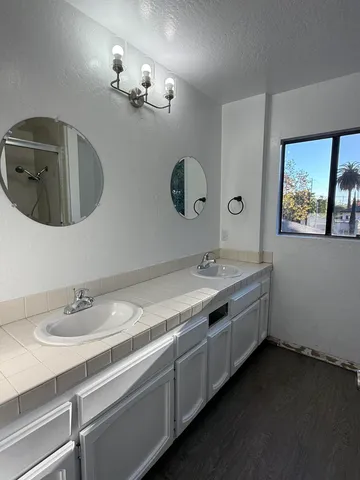 a view of a chairs and table in back yard of the building