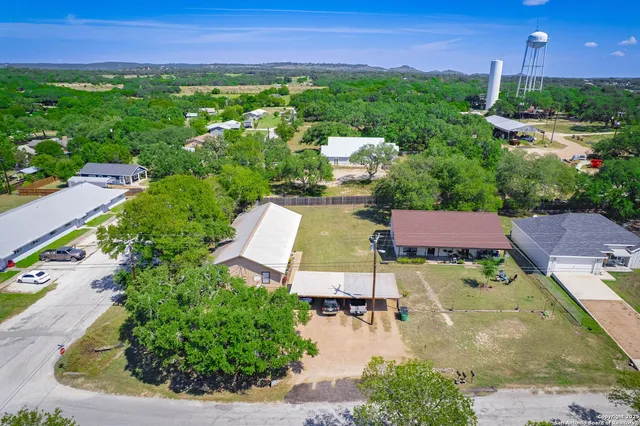 an aerial view of a house with a garden