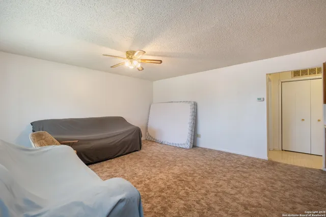 a kitchen with stainless steel appliances granite countertop a sink a stove and cabinets