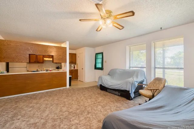 a kitchen with stainless steel appliances granite countertop a sink and a microwave