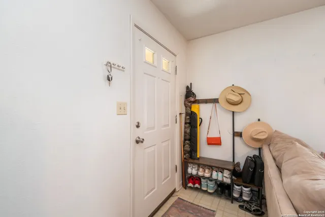 a bedroom with furniture and a chandelier