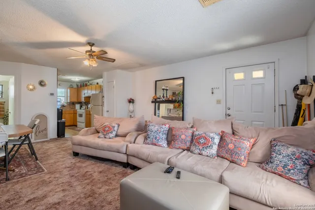 a bed room with a bed and a chair