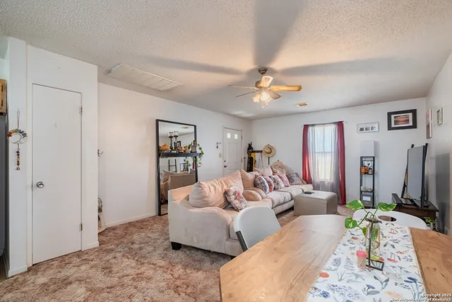 a kitchen with a sink a refrigerator a washer and dryer