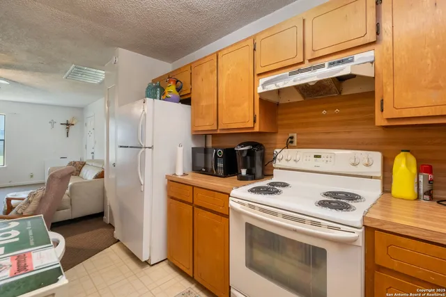 a bathroom with a sink toilet and a mirror