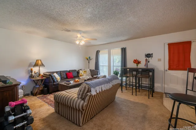 a living room with furniture and a table