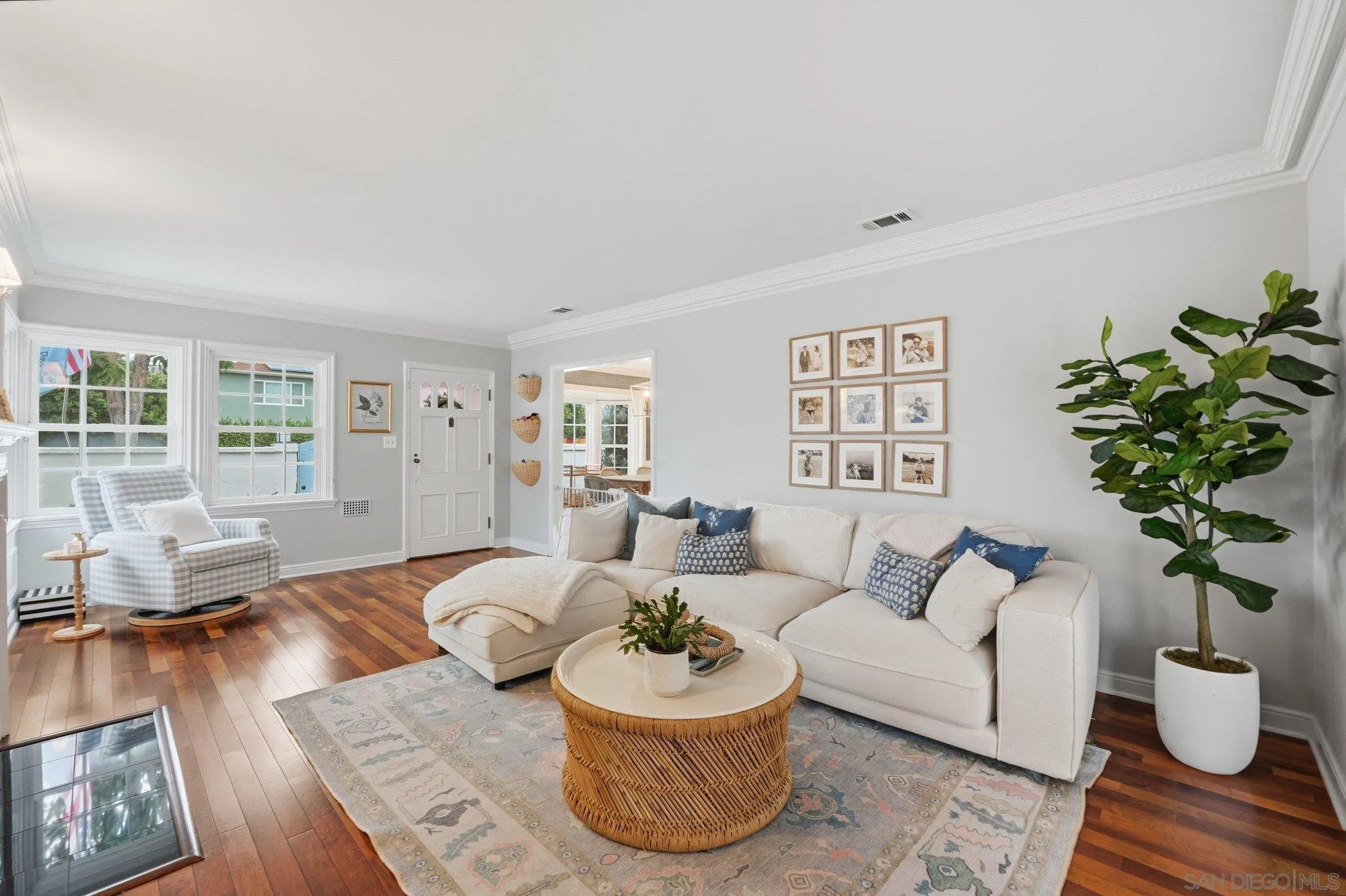 1210 Third Street Coronado, CA 92118 - Photo 5 of 22 a living room with furniture and a potted plant