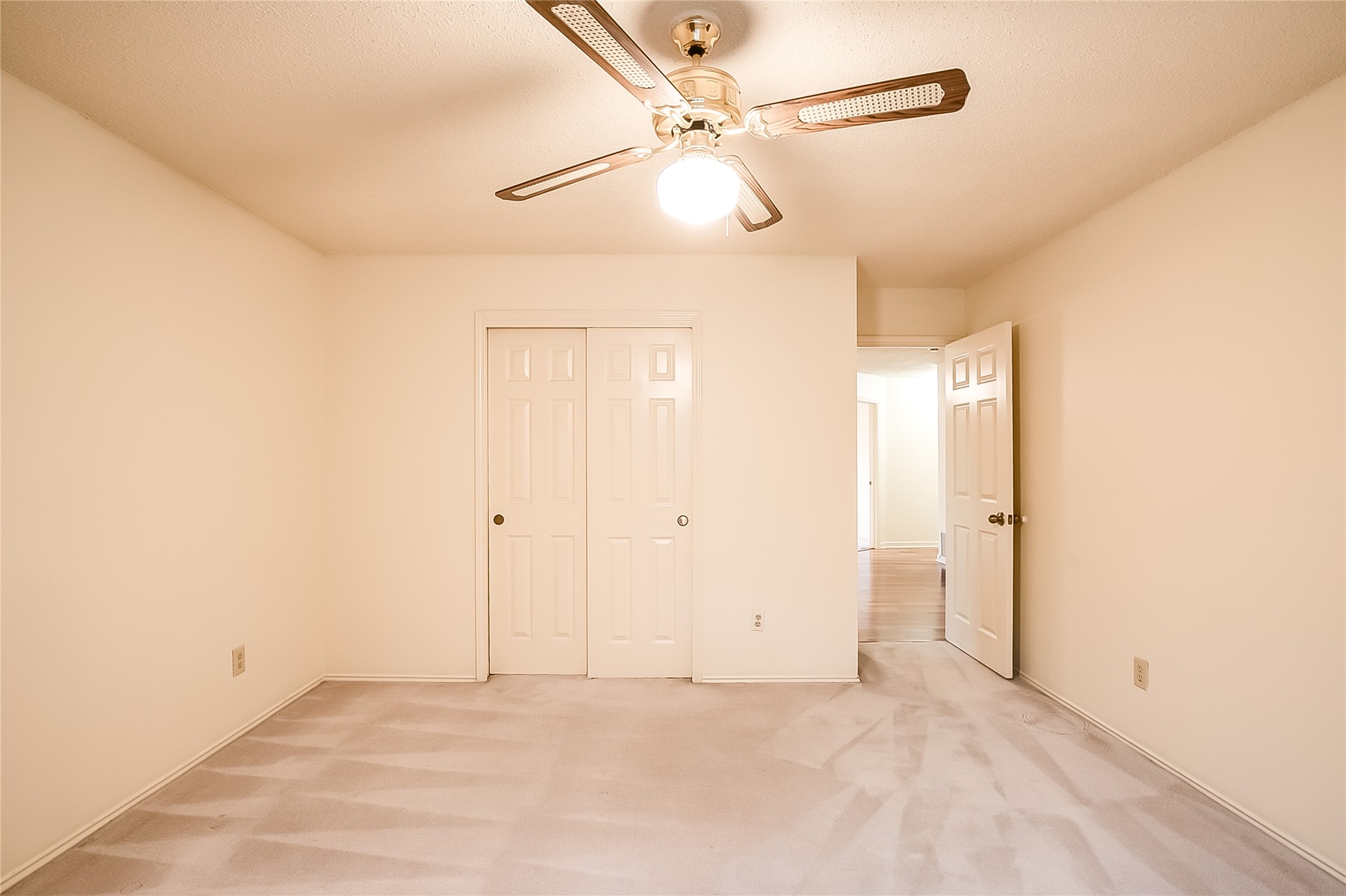 6914 Dallas Drive Austin, TX 78729 - Photo 24 of 31 an empty room with fan and a ceiling fan