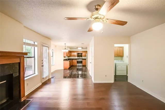 a view of livingroom with hardwood floor and a ceiling fan
