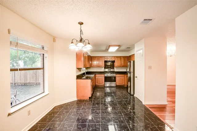a view of a kitchen and dining room