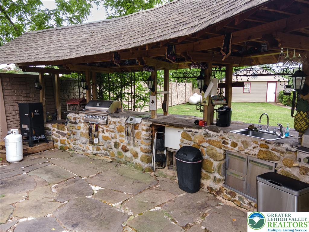 2485 Hieter Road Quakertown, PA 18951 - Photo 83 of 97 An outdoor kitchen, complete with a grill and sink, invites open-air entertaining.