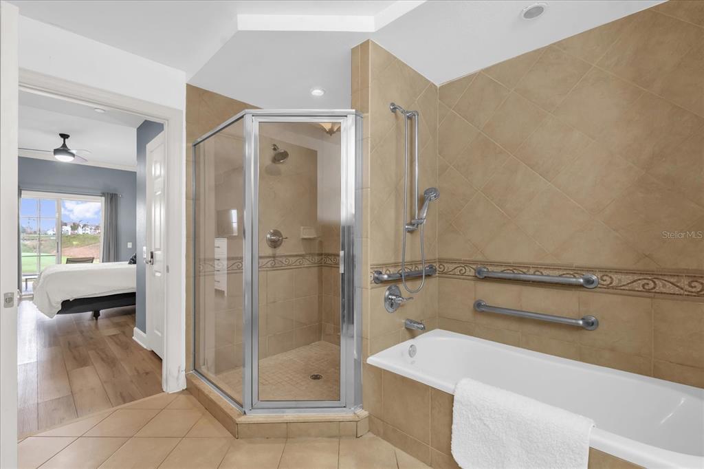 1362 Centre Ct Ridge Drive, Unit 102 Reunion, FL 34747 - Photo 14 of 35 a bathroom with a shower and a sink