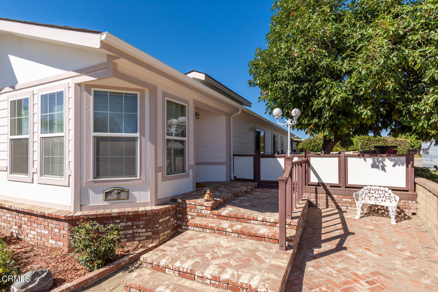 11405 Darling Road, Unit 1 Ventura, CA 93004 - Photo 2 of 31 a view of a house with backyard and sitting area