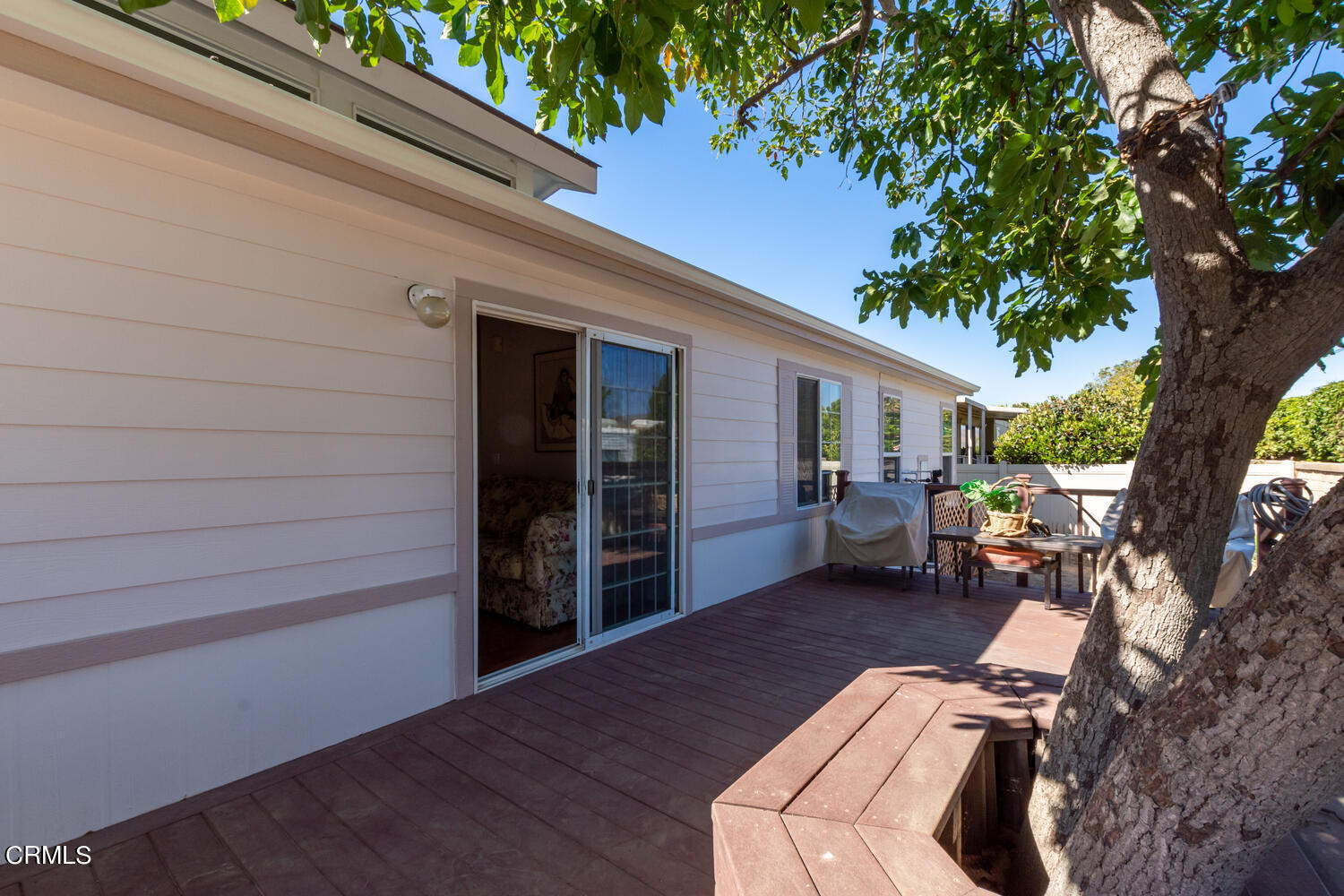 11405 Darling Road, Unit 1 Ventura, CA 93004 - Photo 24 of 31 a view of a porch with furniture and a tree